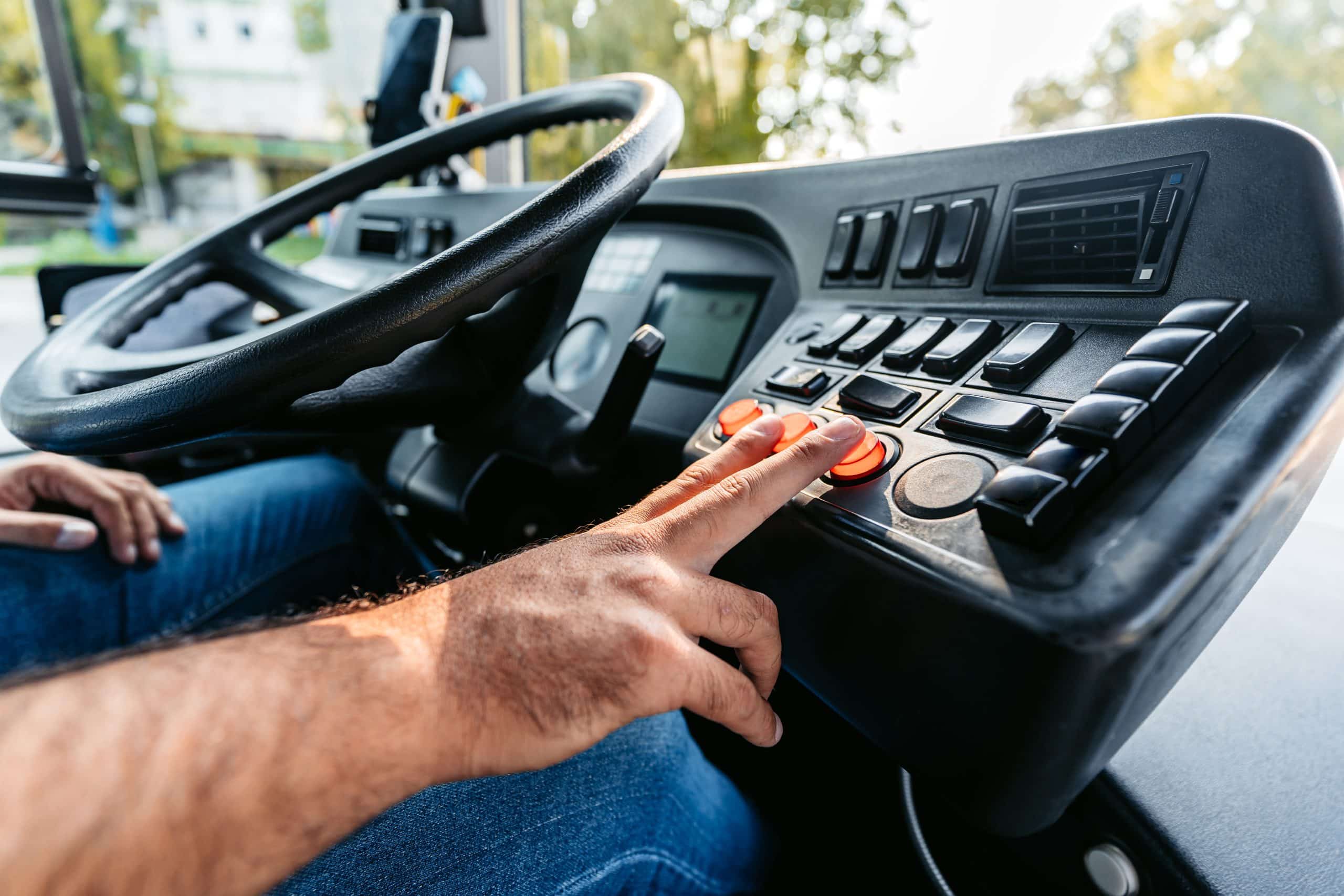 Mid Adult Man Driving A Bus On The Street