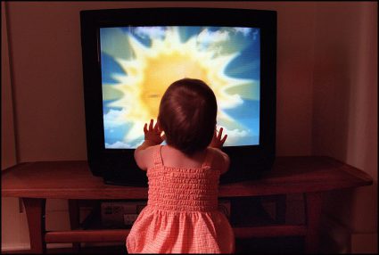 A Toddler Watches Teletubbies On Television Set On 28 December 2001. Afr Generi